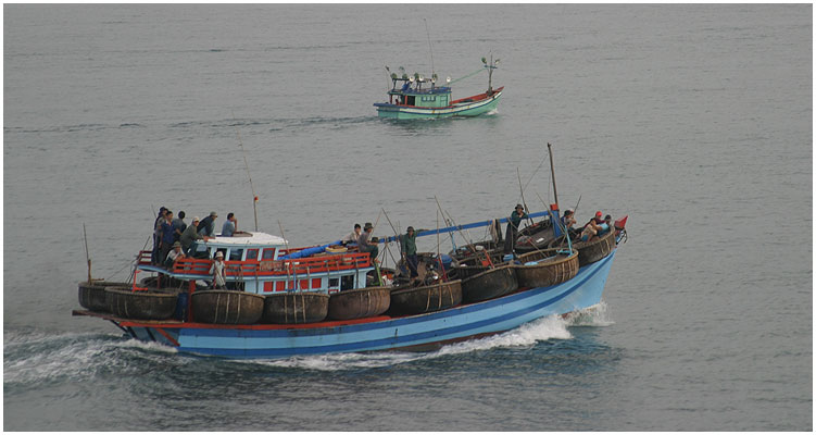 The fishing boat with the classic corracles for each a few men is headding for the target area to fish.